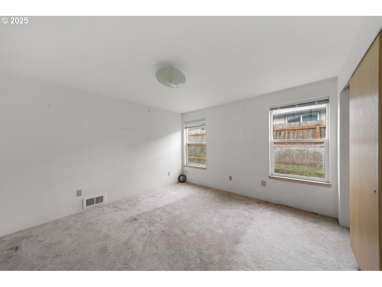 1924 Garfield Street North Bend, OR 97459 - Photo 10 of 33 a view of an empty room with a window
