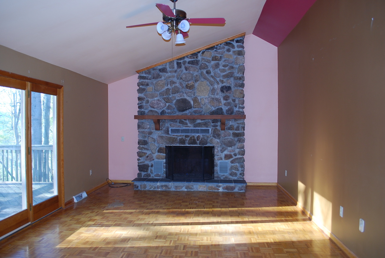 444 Iron Ridge Road Rocky Mount, VA 24151 - Photo 2 of 34 a living room with a fireplace