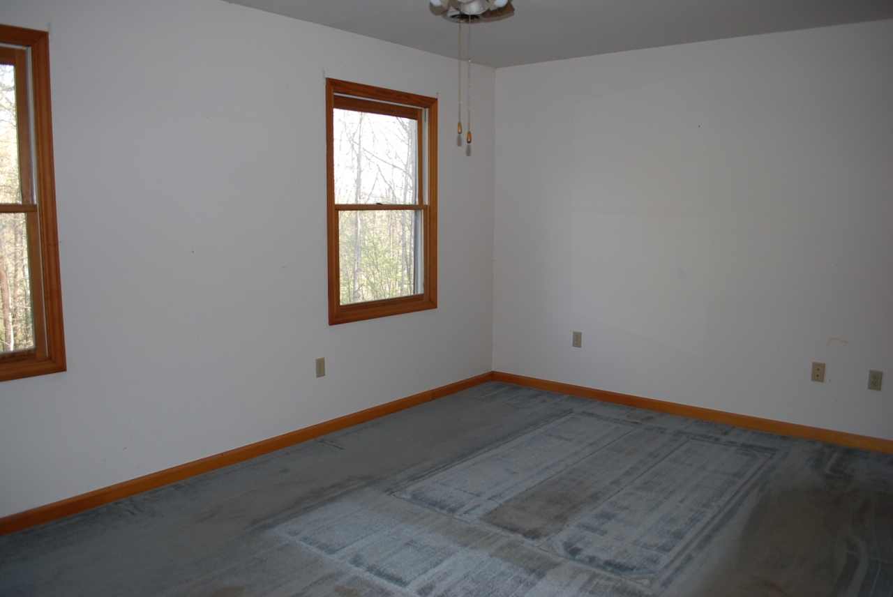 444 Iron Ridge Road Rocky Mount, VA 24151 - Photo 16 of 34 an empty room with a window