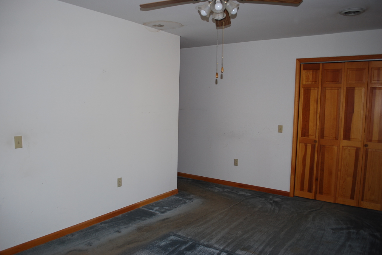 444 Iron Ridge Road Rocky Mount, VA 24151 - Photo 18 of 34 a view of an empty room with wooden floor