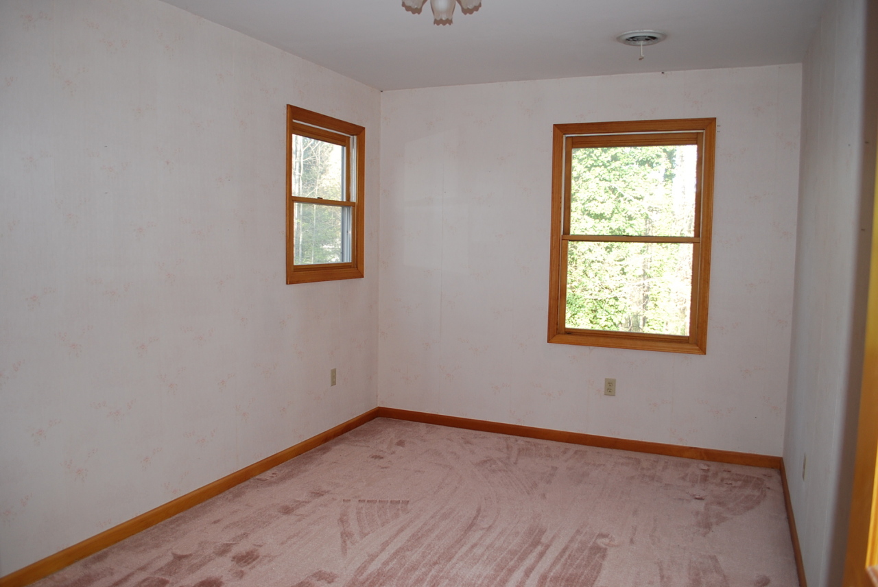 444 Iron Ridge Road Rocky Mount, VA 24151 - Photo 19 of 34 an empty room with a window