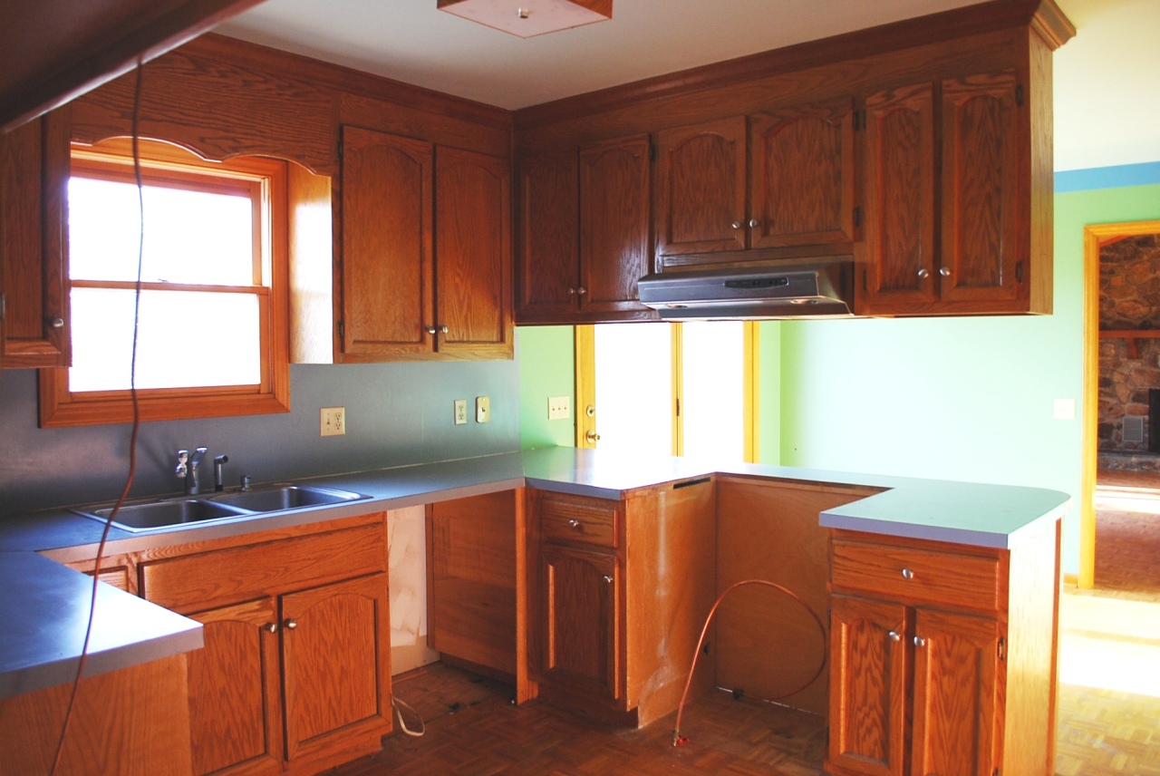 444 Iron Ridge Road Rocky Mount, VA 24151 - Photo 5 of 34 a kitchen with stainless steel appliances wooden cabinets a sink and a large window
