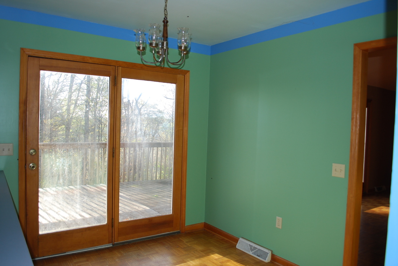 444 Iron Ridge Road Rocky Mount, VA 24151 - Photo 6 of 34 a room with window and a chandelier