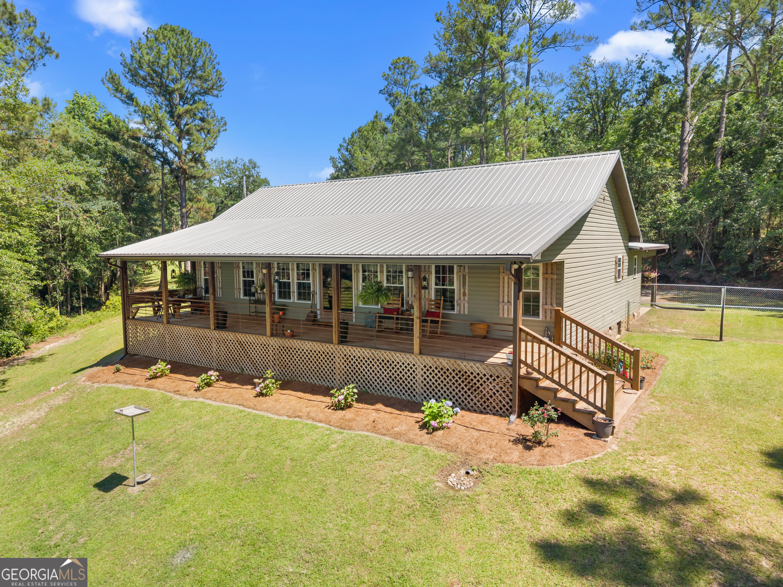 418 Oglesby Pond Road Portal, GA 30450 - Photo 7 of 84 a view of a house with a backyard