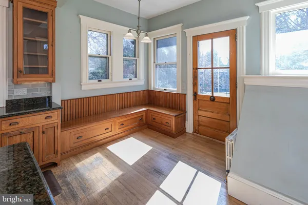 a kitchen with stainless steel appliances a stove top oven a sink a refrigerator and cabinets