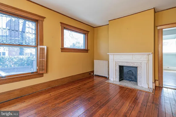 a view of entryway with wooden floor and stairs