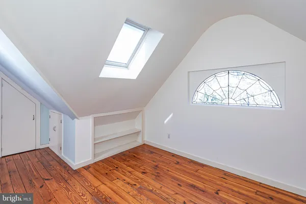 a bathroom with a sink and a large mirror