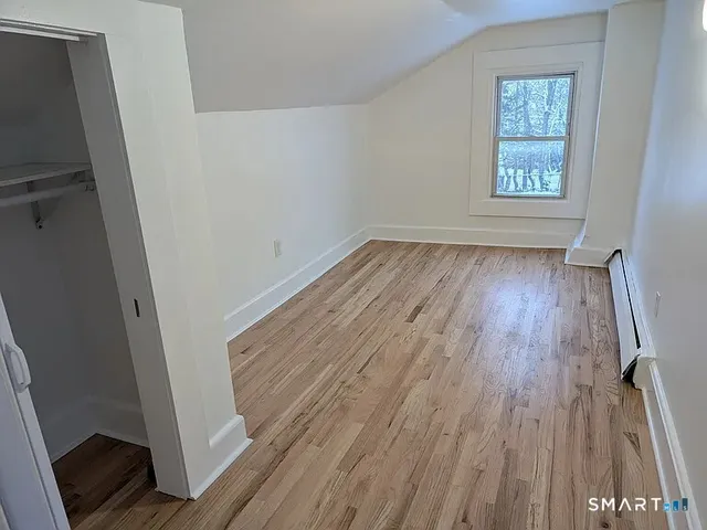 a view of entryway with wooden floor