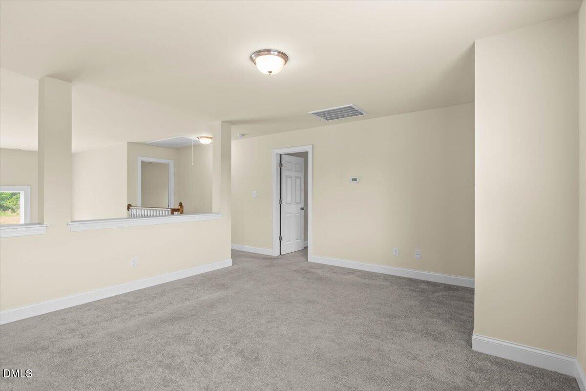 704 Haw River Hopedale Road Burlington, NC 27217 - Photo 29 of 49 a view of an empty room with a window