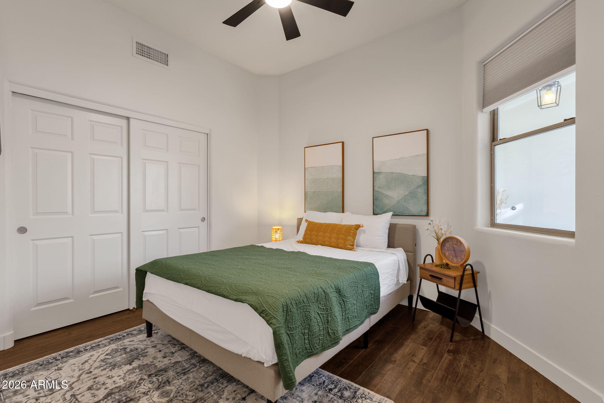 14604 East Peak View Road Scottsdale, AZ 85262 - Photo 16 of 55 a bedroom with a bed and wooden floor
