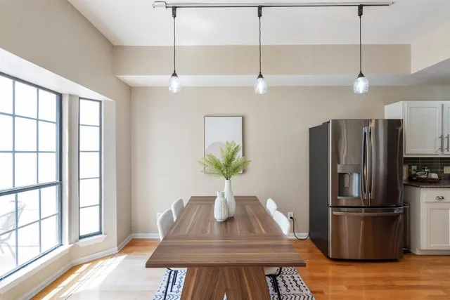 a kitchen with kitchen island a counter space a sink appliances and cabinets