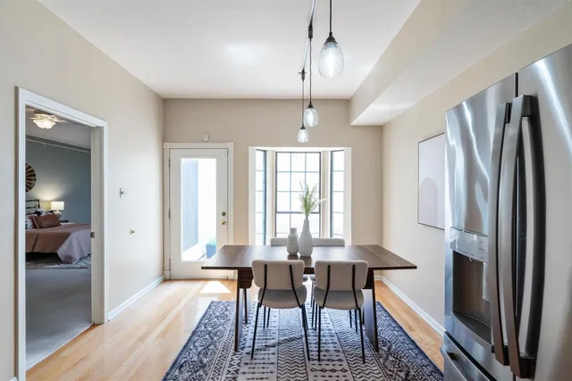 a view of a dining room with furniture window and wooden floor
