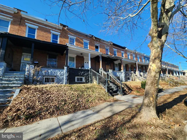 a view of a house with large windows