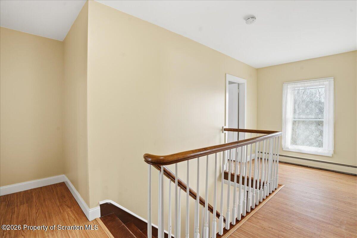 795 Wescott Road New Milford, PA 18834 - Photo 43 of 81 a view of a hallway with wooden floor and entryway