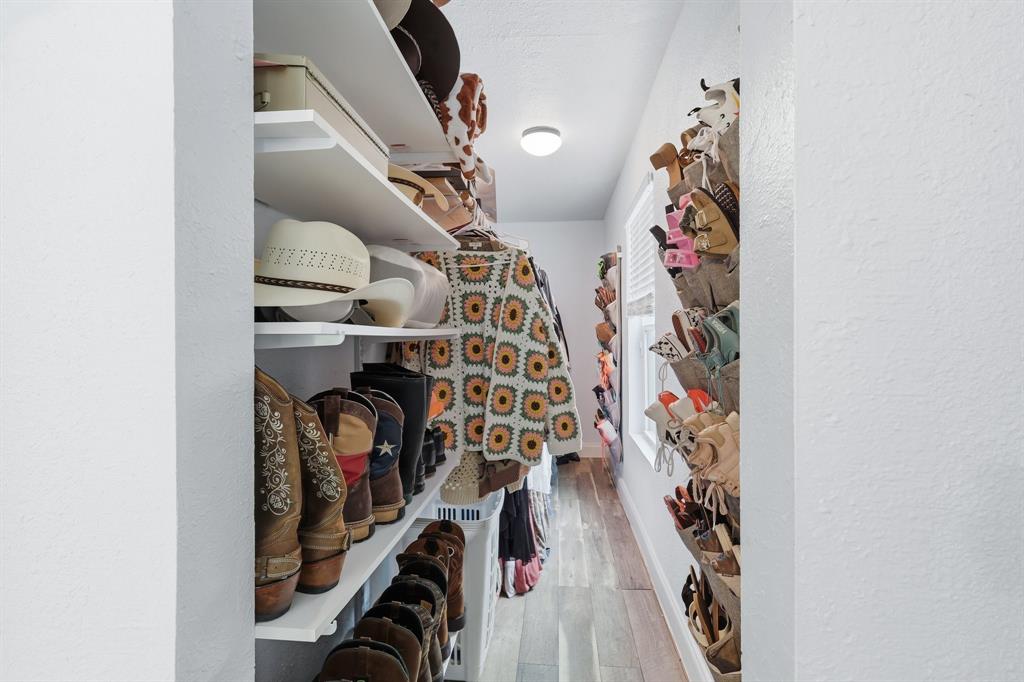 767 East Barry Street Azle, TX 76020 - Photo 24 of 40 The property features custom storage solutions including shelving and wall-mounted shoe organizers
