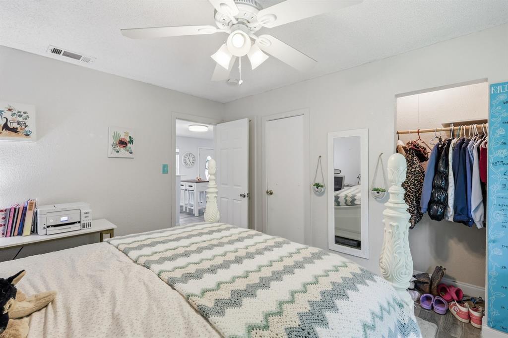 767 East Barry Street Azle, TX 76020 - Photo 25 of 40 The room features a white ceiling fan with integrated lighting
