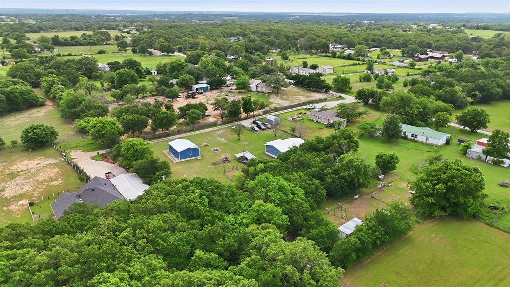 767 East Barry Street Azle, TX 76020 - Photo 9 of 40 The property offers a vast landscape with substantial green spaces and a variety of mature trees