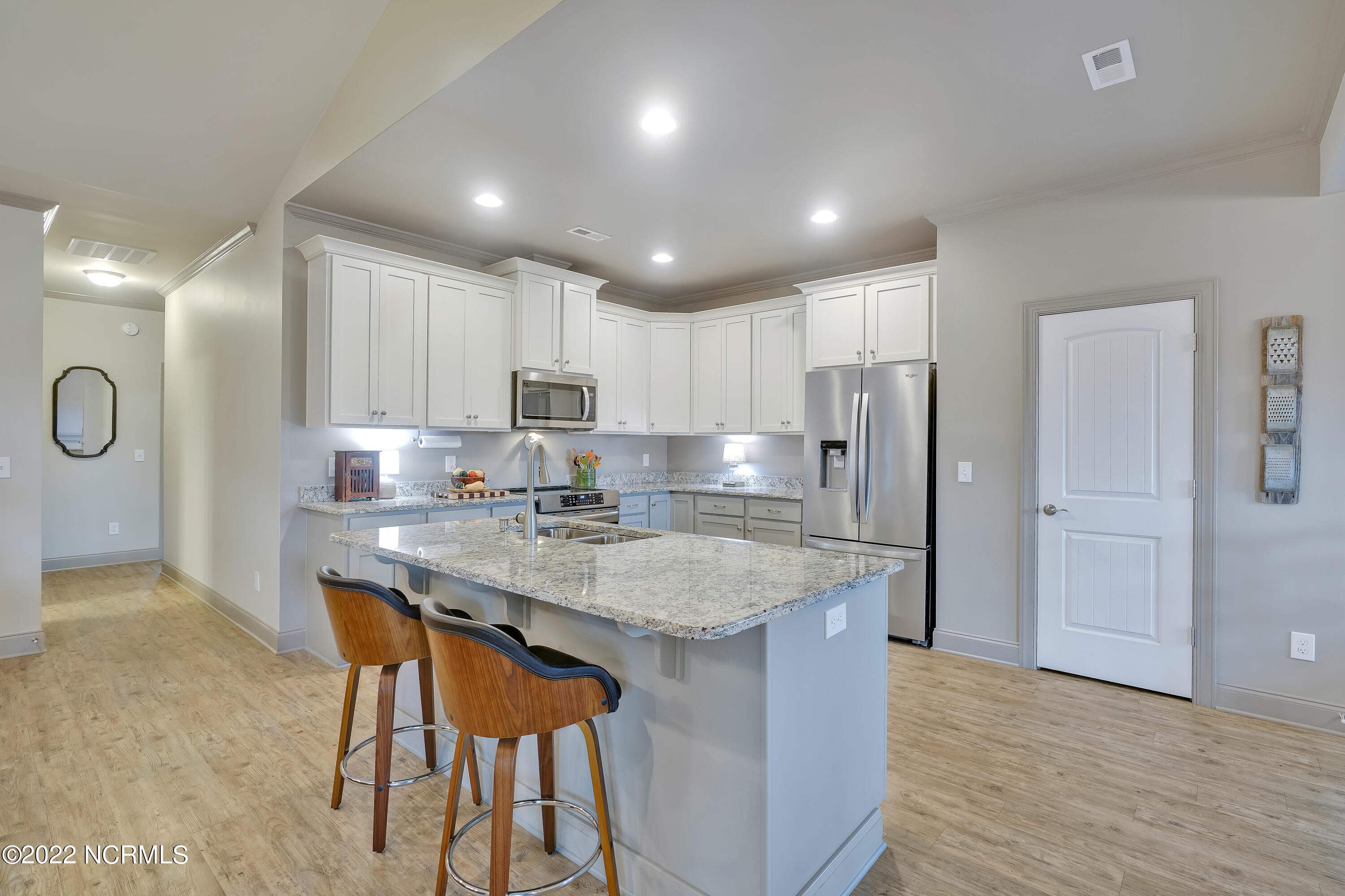 1663 Pinnacle Parkway Hampstead, NC 28443 - Photo 18 of 53 Kitchen with granite countertops and oversized island