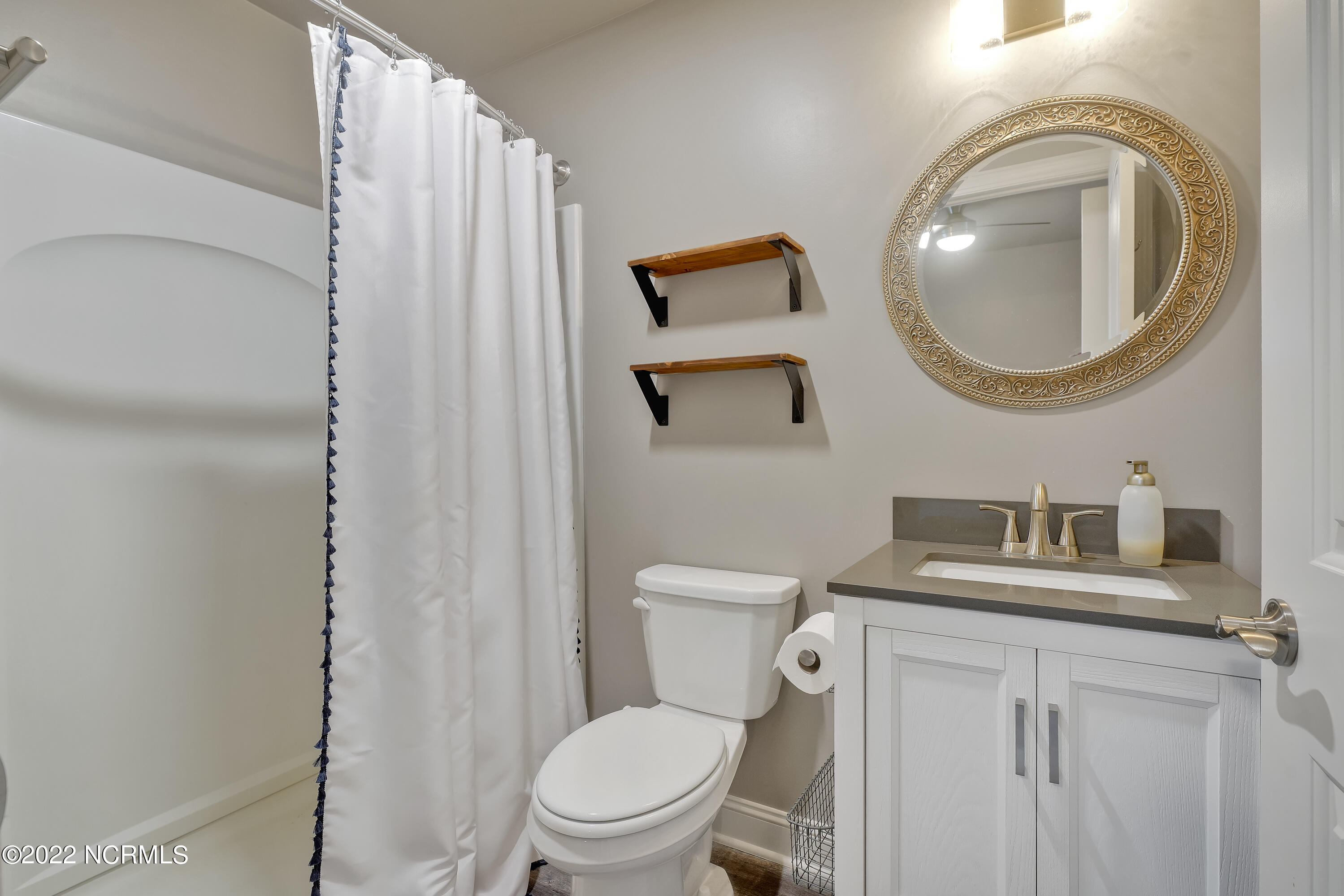 1663 Pinnacle Parkway Hampstead, NC 28443 - Photo 44 of 53 Master Bed bathroom