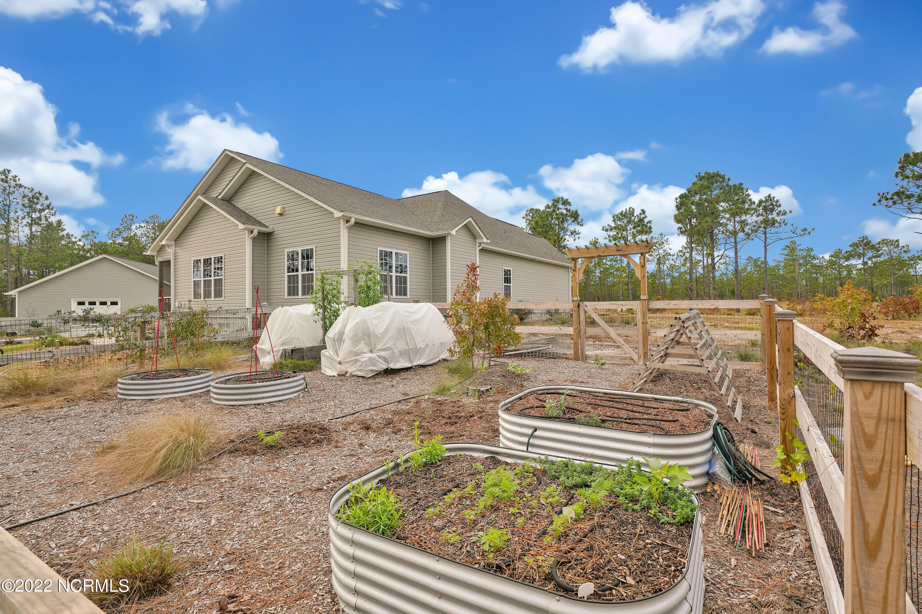 1663 Pinnacle Parkway Hampstead, NC 28443 - Photo 49 of 53 Garden boxes behind main home