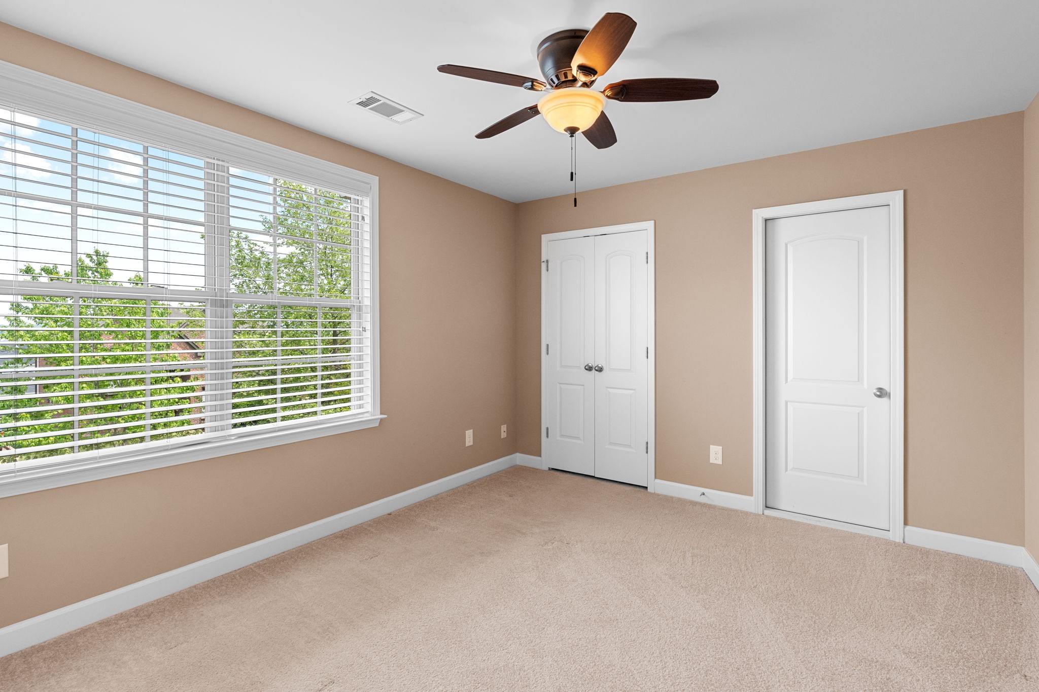 114 Wise Road Franklin, TN 37064 - Photo 33 of 57 Bedroom 4 (also connected to the bath) includes custom window blinds and a ceiling fan. There is also walk-in attic storage located off of this bedroom.