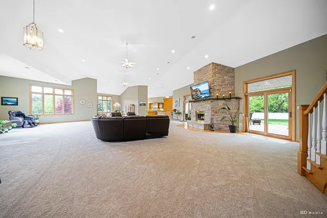 a kitchen with stainless steel appliances granite countertop a stove and a microwave