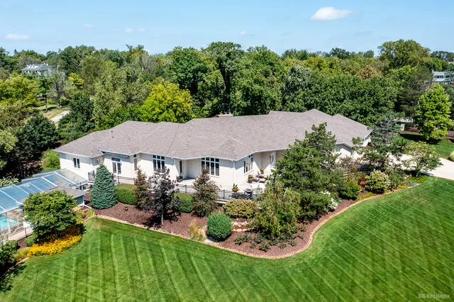 a view of a house with a garden and plants