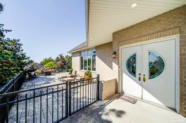 a living room with furniture gym equipment and a fireplace