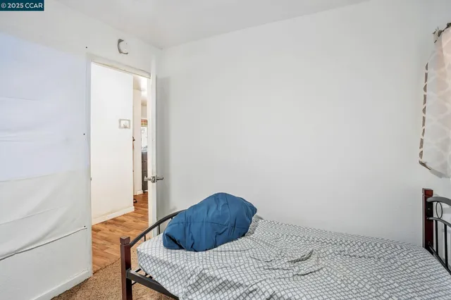 a bedroom with a bed and a table