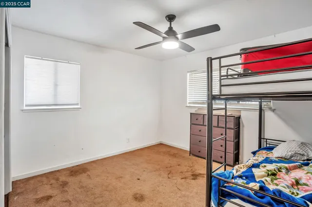 a view of a bedroom with furniture and toys
