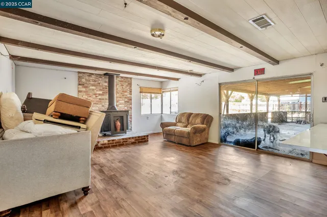 a living room with furniture window and wooden floor