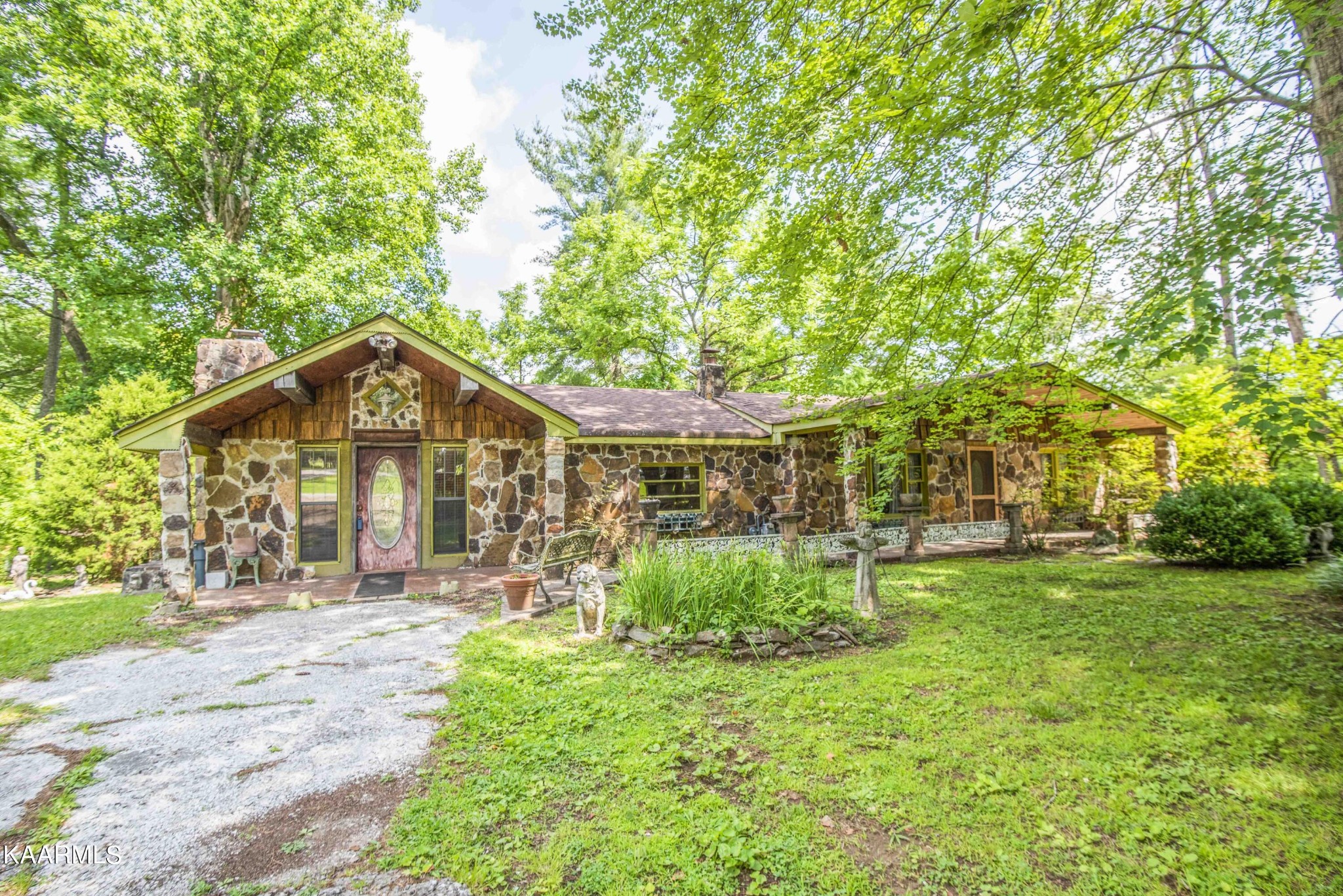1104 Blockhouse Valley Road Clinton, TN 37716 - Photo 1 of 56 a front view of a house with a yard