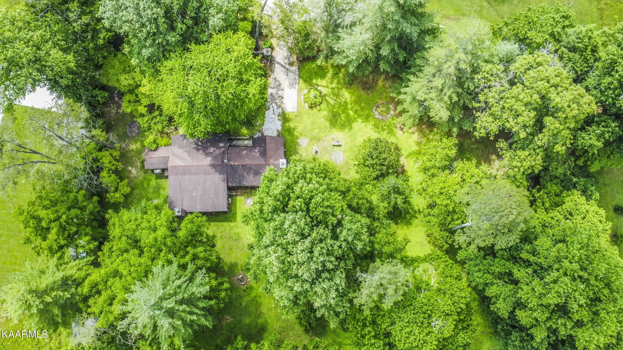 1104 Blockhouse Valley Road Clinton, TN 37716 - Photo 31 of 56 a backyard of a house with lots of green space