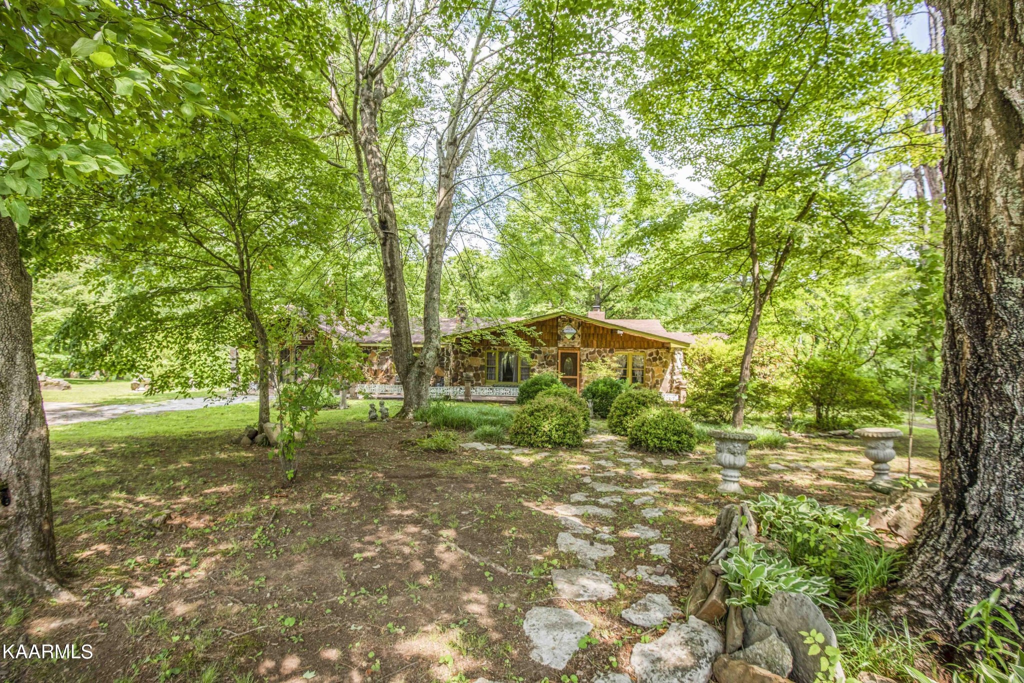 1104 Blockhouse Valley Road Clinton, TN 37716 - Photo 48 of 56 a big yard with lots of green space and house in the back