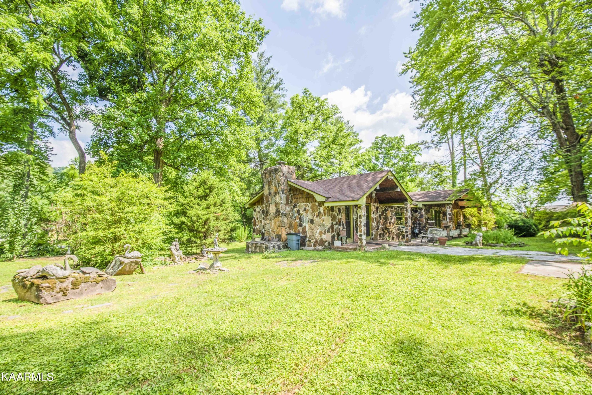 1104 Blockhouse Valley Road Clinton, TN 37716 - Photo 49 of 56 a view of a house with a yard and swimming pool