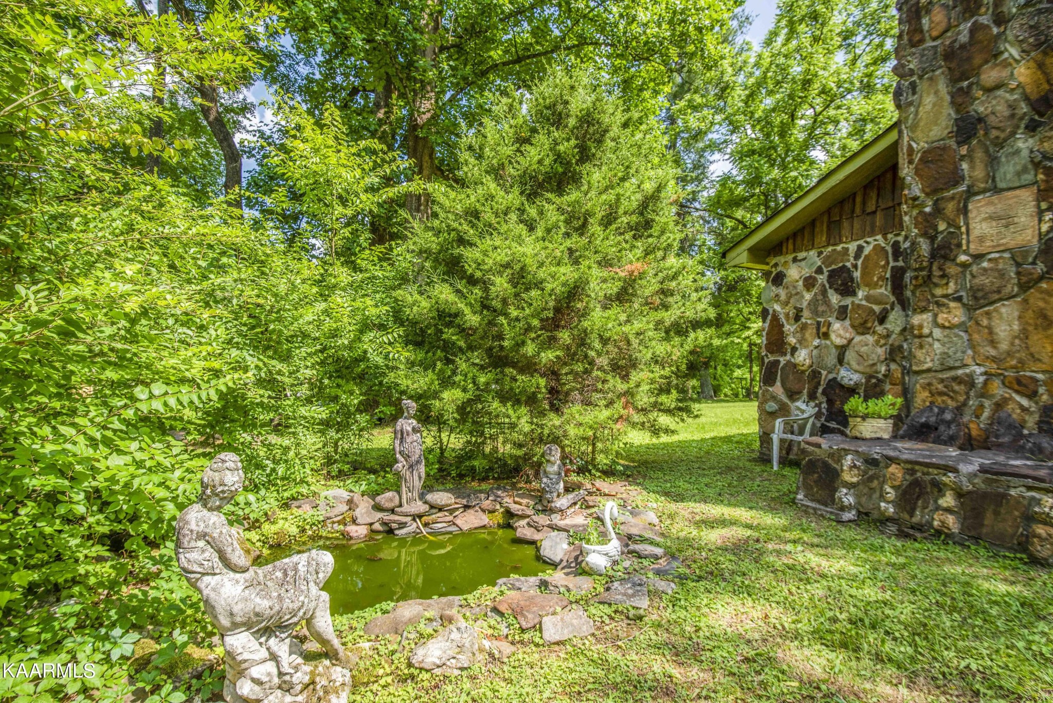 1104 Blockhouse Valley Road Clinton, TN 37716 - Photo 51 of 56 a backyard of a house with lots of green space