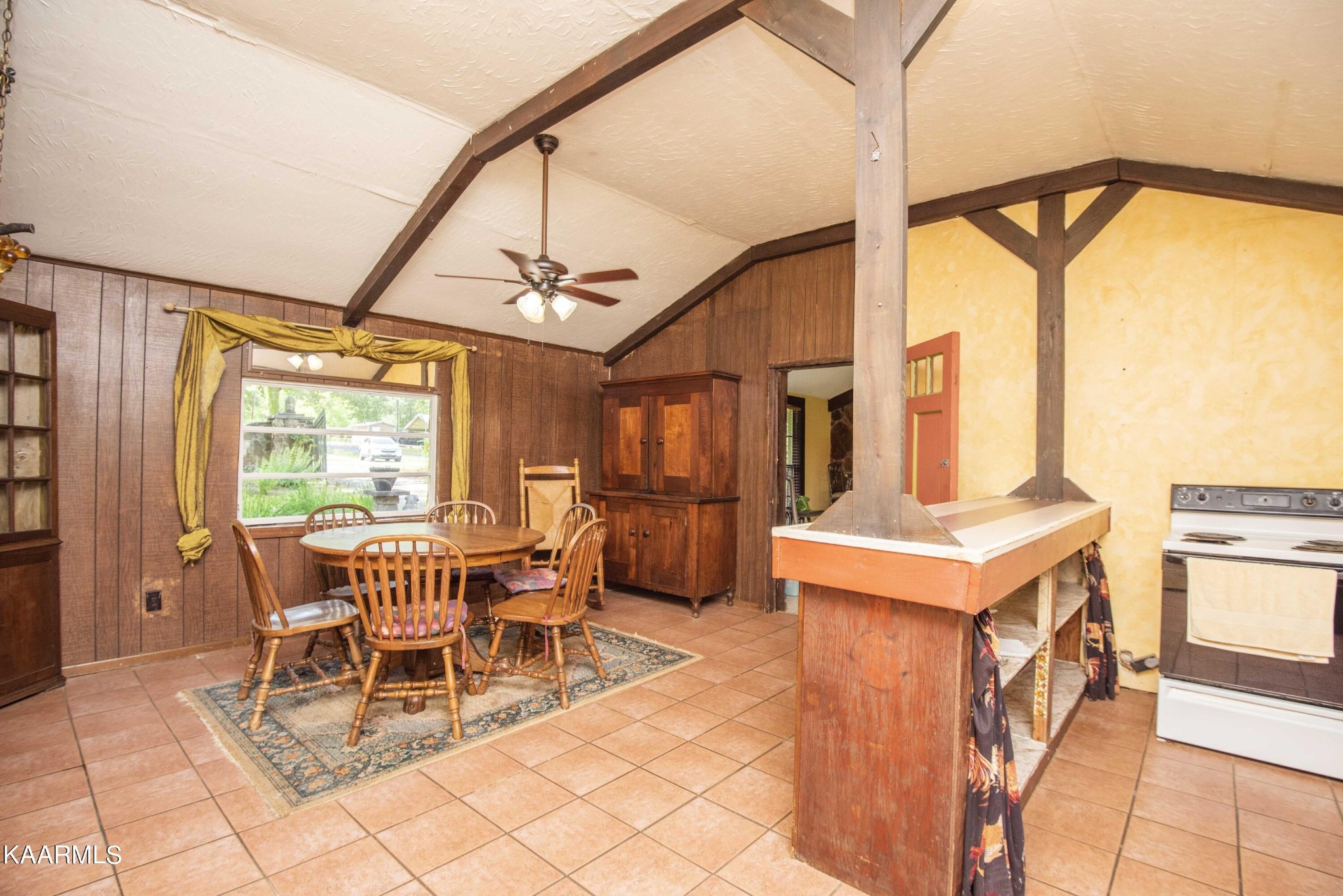 1104 Blockhouse Valley Road Clinton, TN 37716 - Photo 8 of 56 a dining room with furniture a rug and a chandelier