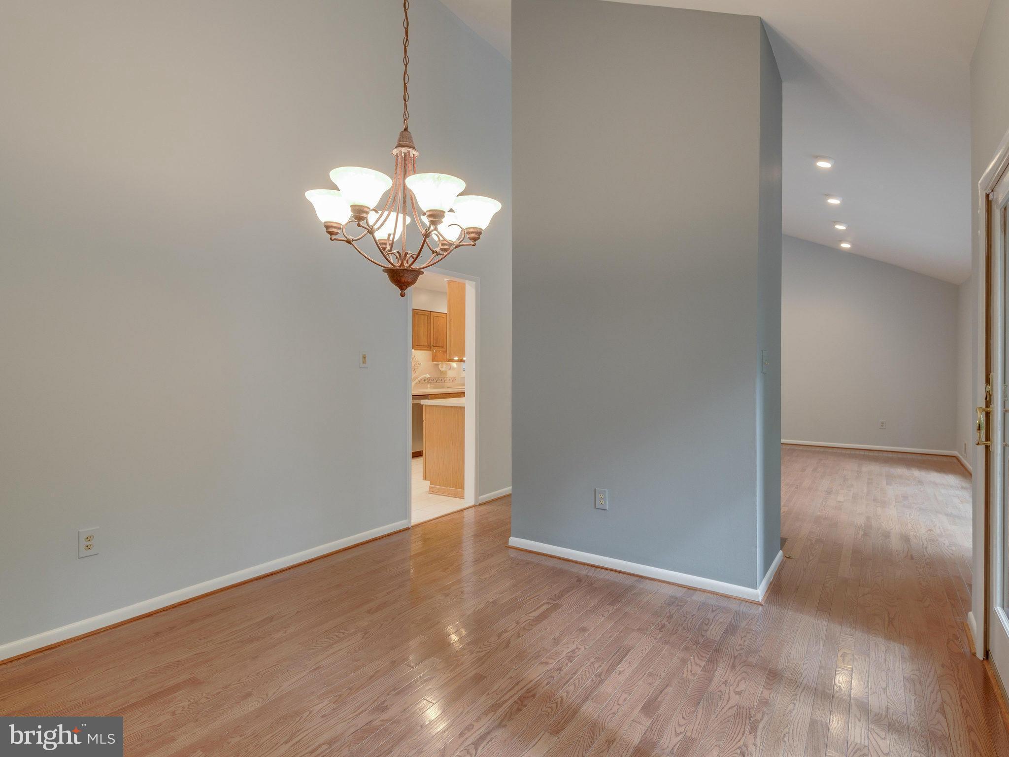 2437 Freetown Drive Reston, VA 20191 - Photo 13 of 30 a view of a chandelier in big room and chandelier