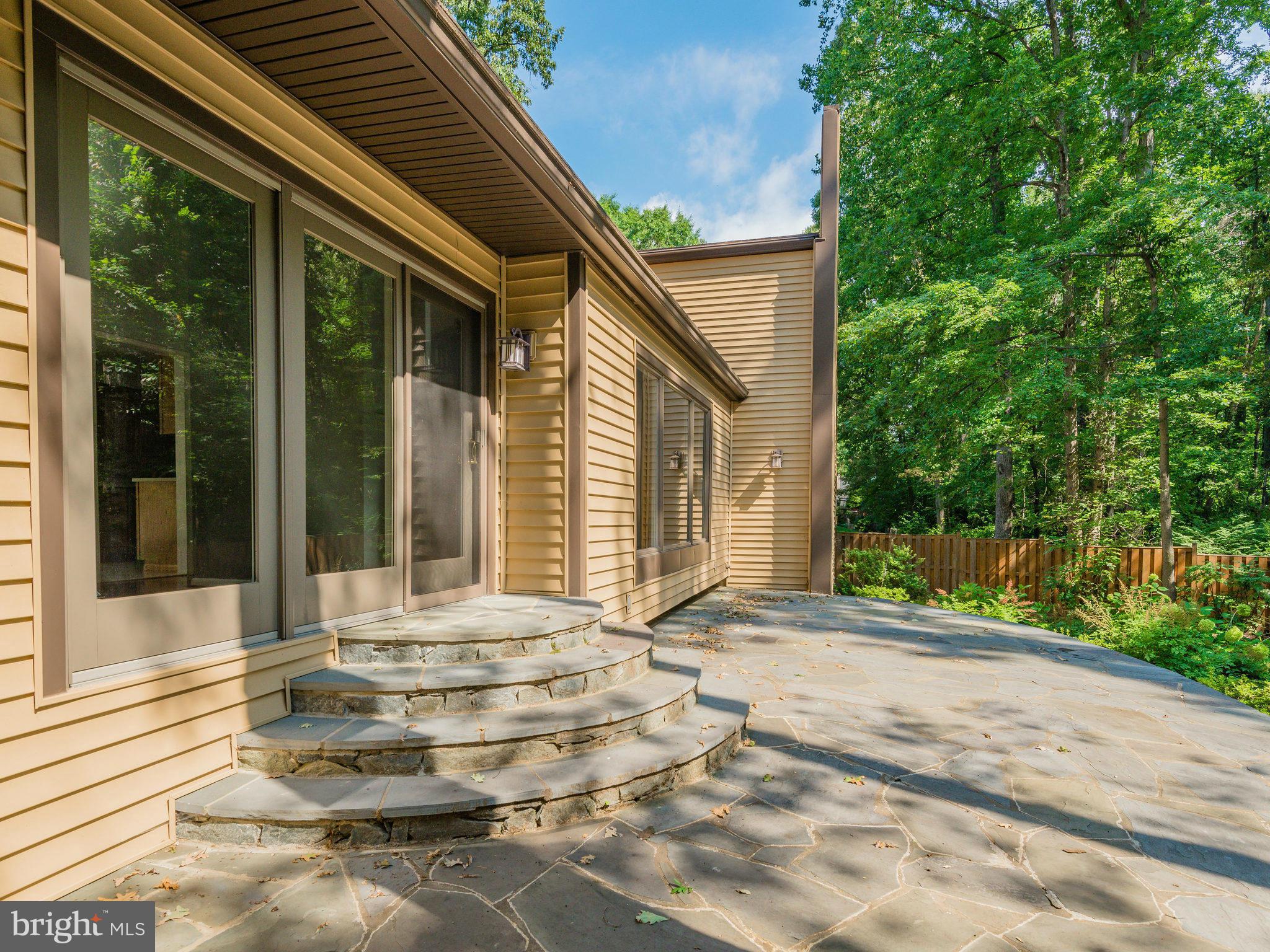 2437 Freetown Drive Reston, VA 20191 - Photo 3 of 30 a front view of a house with a yard