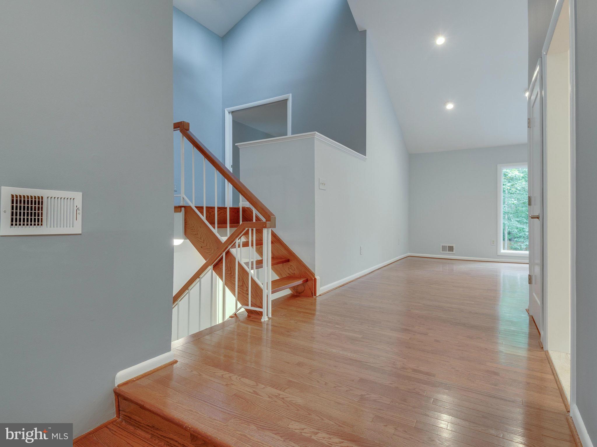 2437 Freetown Drive Reston, VA 20191 - Photo 8 of 30 a view of entryway and hall with wooden floor