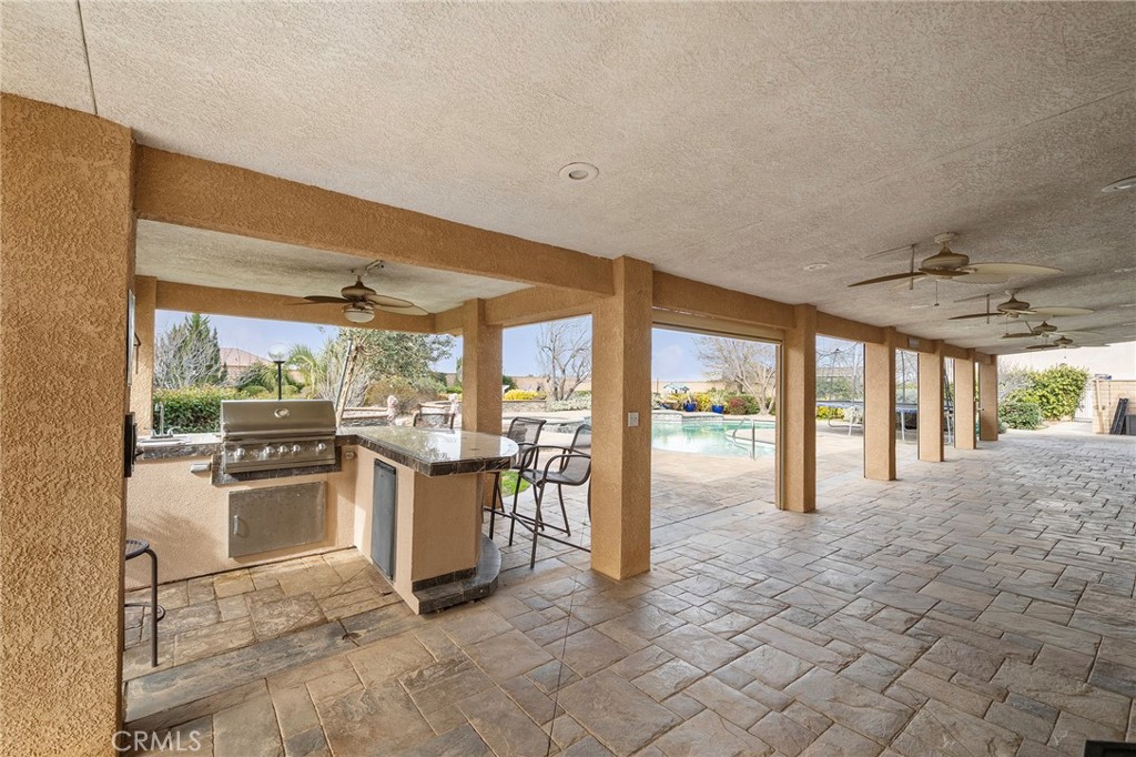 7172 Jargon Road Hesperia, CA 92344 - Photo 58 of 75 a large white kitchen with a large window and refrigerator