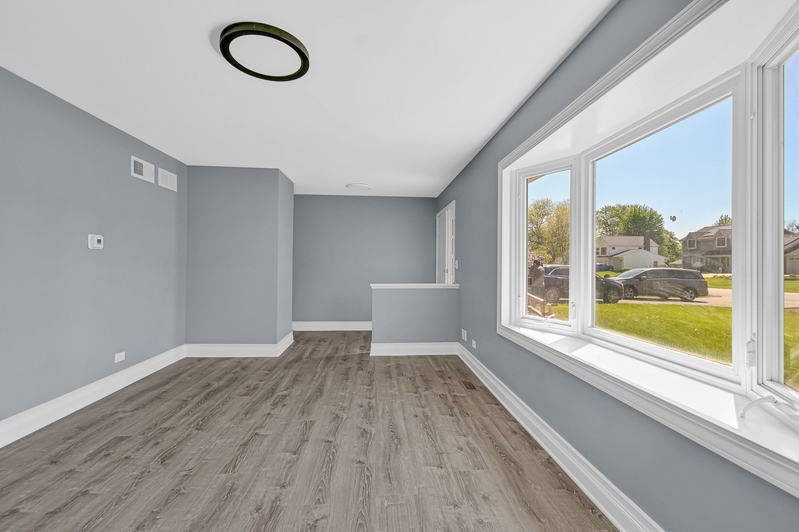 28W502 Leverenz Road Naperville, IL 60564 - Photo 11 of 30 a view of a livingroom with wooden floor and a window