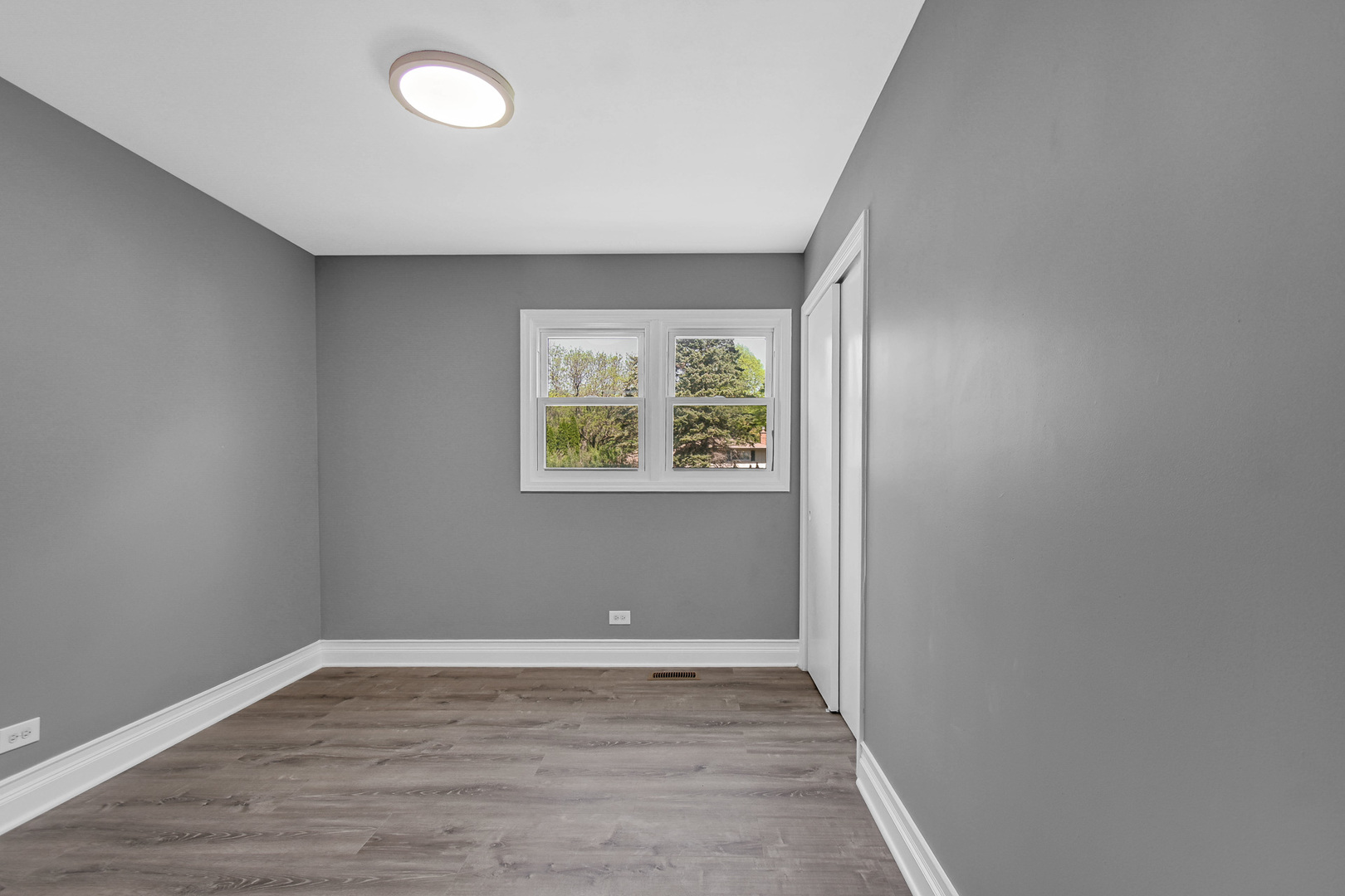 28W502 Leverenz Road Naperville, IL 60564 - Photo 15 of 30 an empty room with wooden floor and window