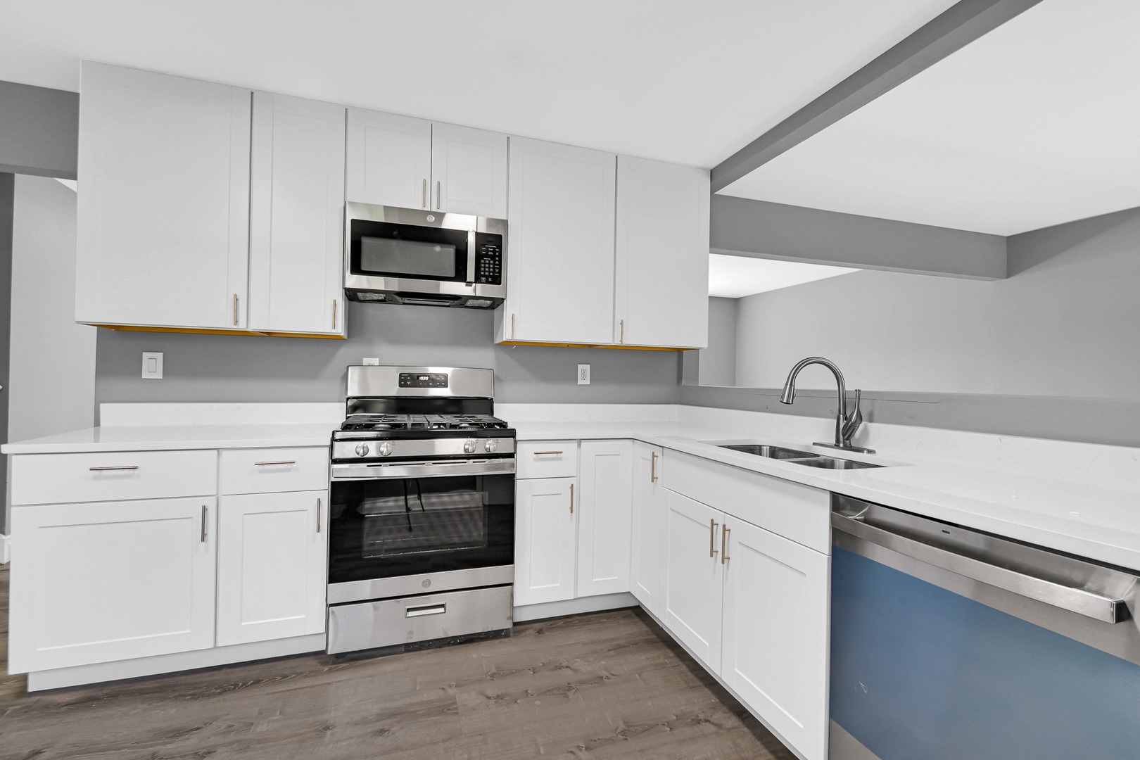 28W502 Leverenz Road Naperville, IL 60564 - Photo 2 of 30 a kitchen with stainless steel appliances granite countertop a sink stove and microwave