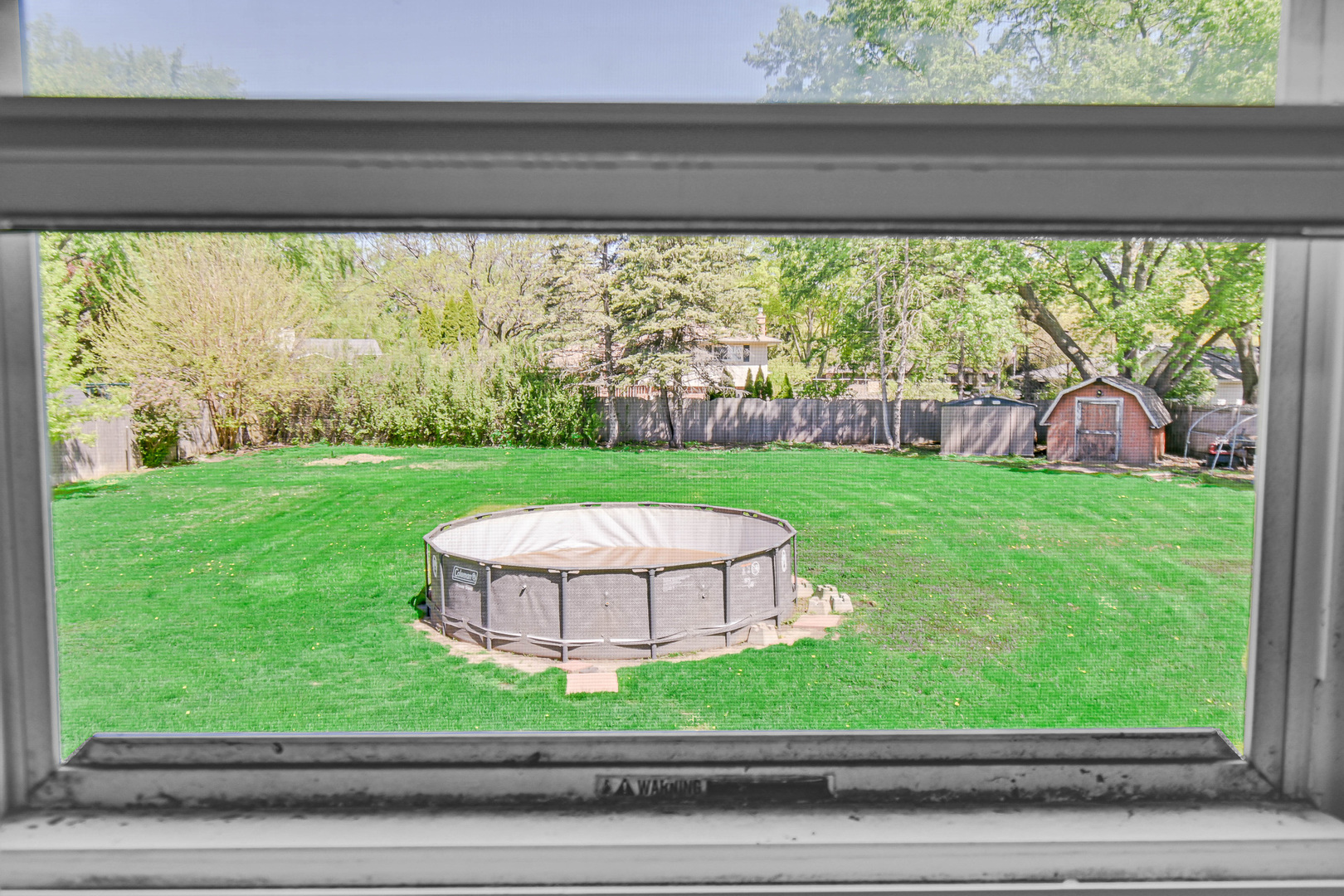 28W502 Leverenz Road Naperville, IL 60564 - Photo 25 of 30 a view of a back yard from a window