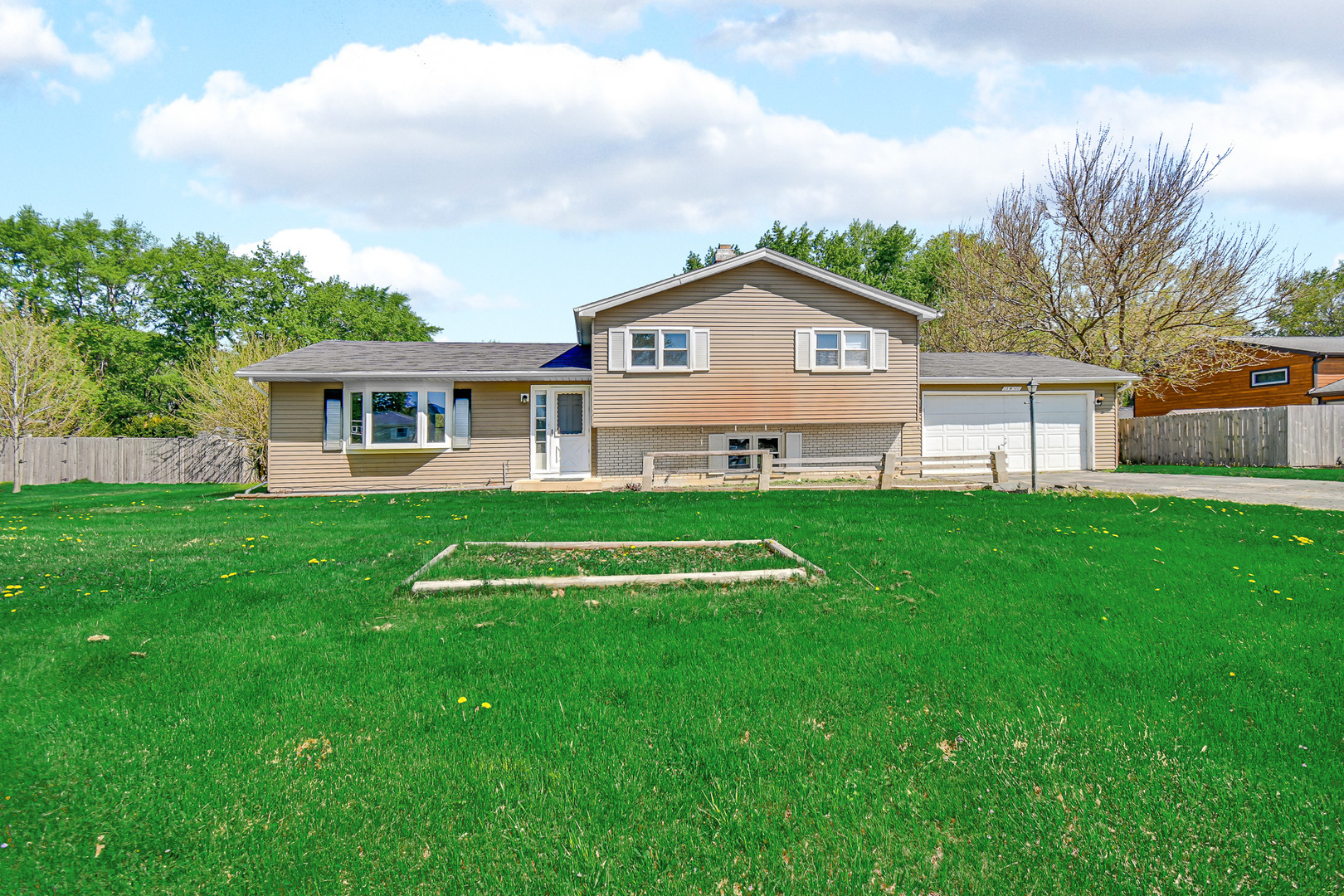 28W502 Leverenz Road Naperville, IL 60564 - Photo 27 of 30 a view of a house with a big yard with plants and large trees