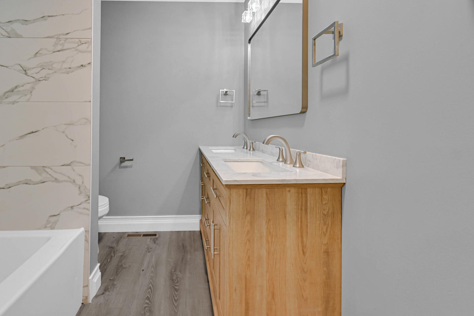 28W502 Leverenz Road Naperville, IL 60564 - Photo 7 of 30 a bathroom with a sink a bathtub and a shower