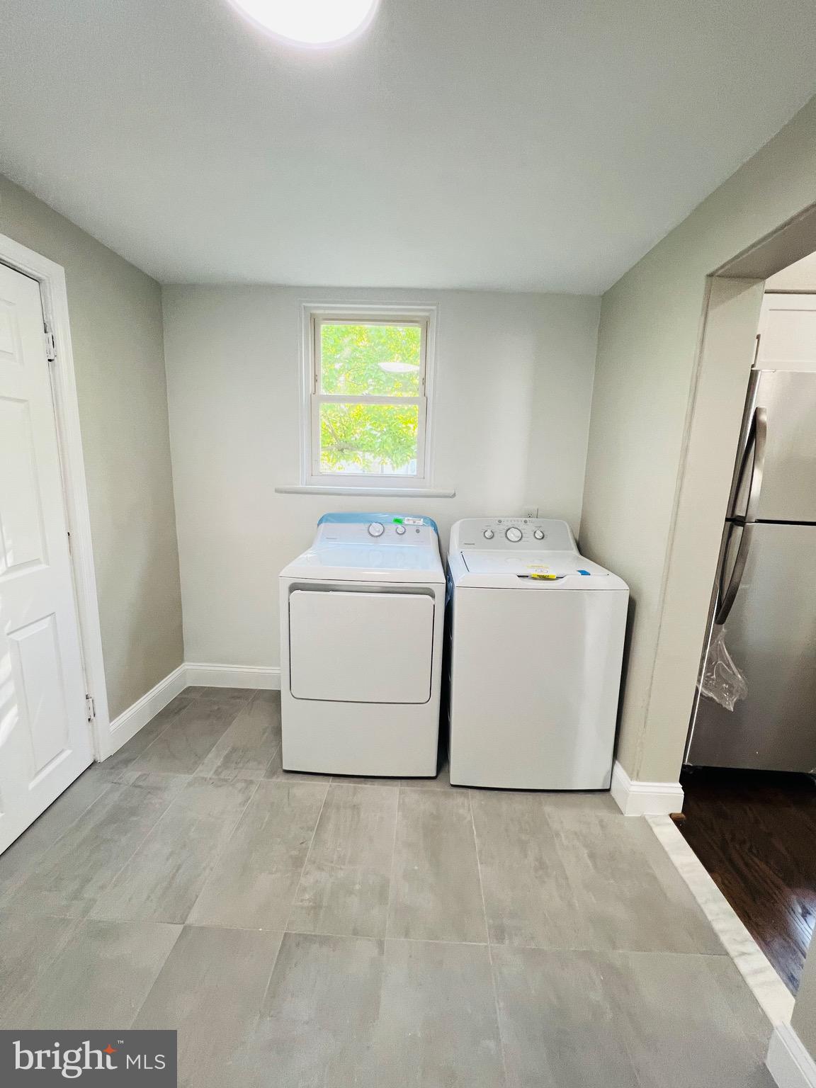 5709 Dade Street Capitol Heights, MD 20743 - Photo 15 of 23 a utility room with dryer and washer