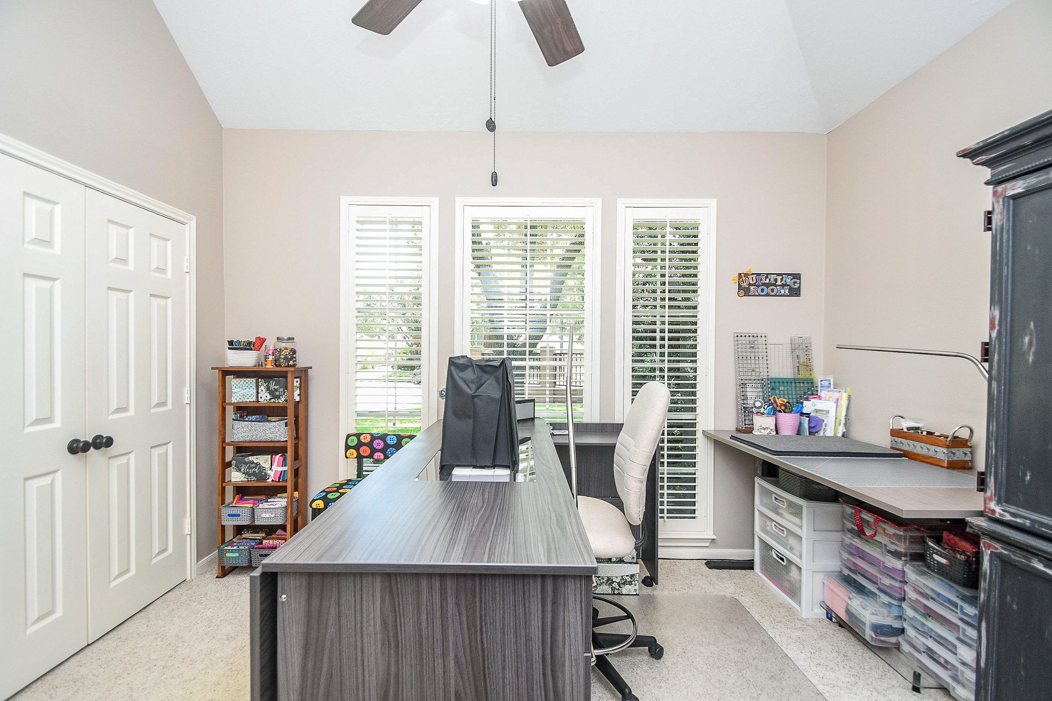 1703 Fall Ridge Circle Katy, TX 77494 - Photo 20 of 38 This FIRST-FLOOR secondary bedroom features a spacious closet and beautiful floor-to-ceiling windows. It is currently utilized as a dedicated sewing room.