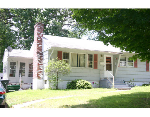 400 Commonwealth Avenue Springfield, MA 01108 - Photo 2 of 2 a front view of a house with a yard